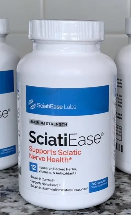A white SciatiEase bottle on a kitchen counter: SciatiEase Labs, Maximum Strength, Supports Sciatic Nerve Health, 12 research backed herbs, vitamins and antioxidants, 120 capsules