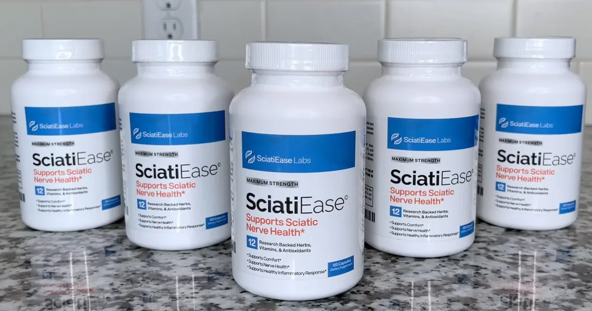 Five white SciatiEase bottles standing on a granite counter